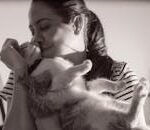 A tender moment captured between a woman and her cat in Heredia, Costa Rica.
